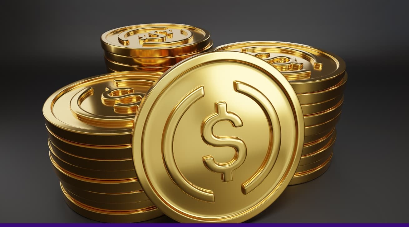 3D illustration of golden stablecoin tokens with a dollar sign, symbolising cryptocurrency and digital finance.