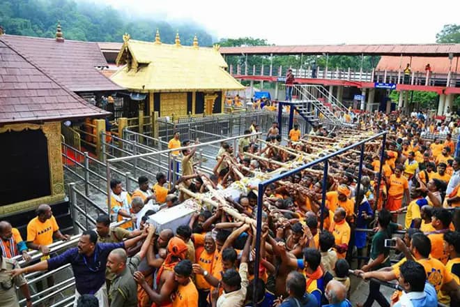 Devotees at Kerala’s Sabarimala Temple during pilgrimage amid legal row over temple fund management and accountability.